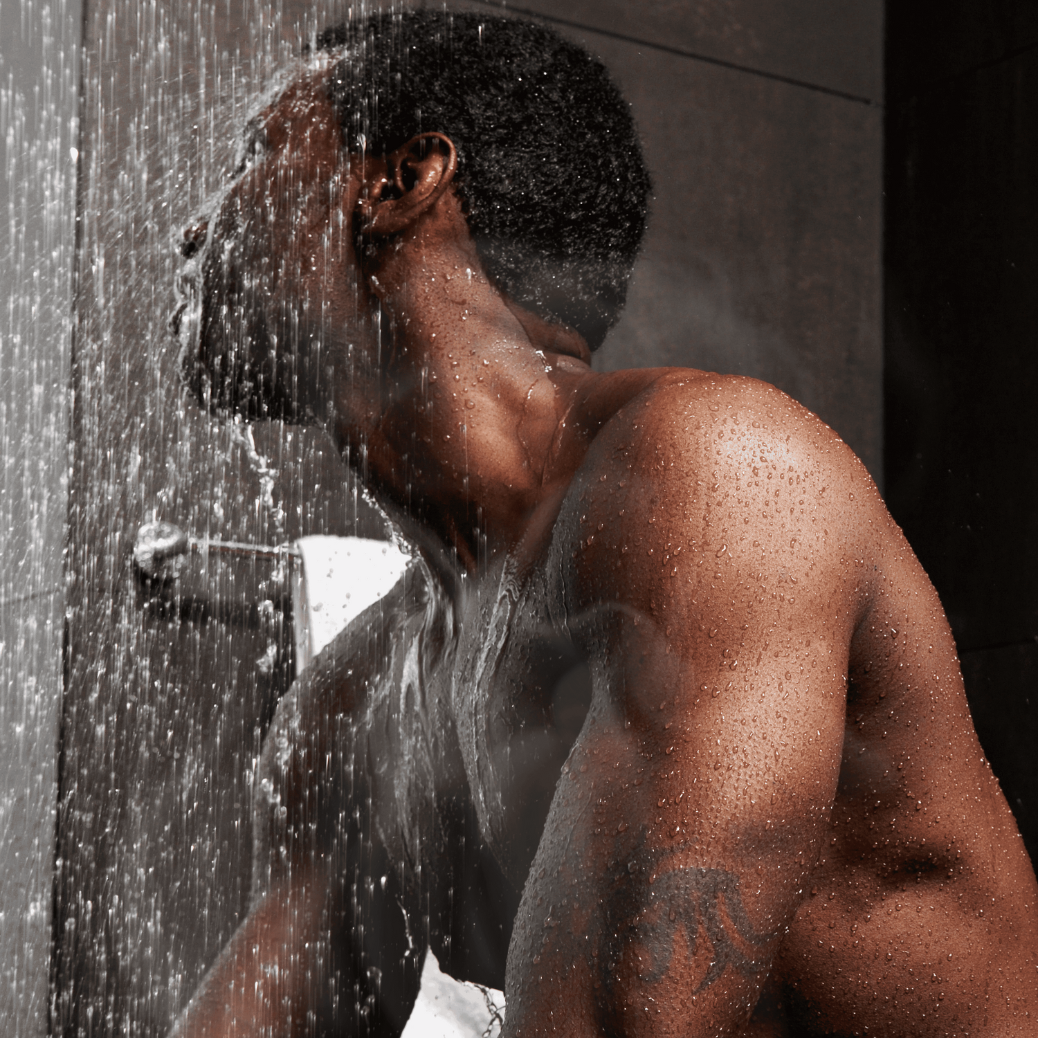 Man breathing in essential oils during aromatherapy steam shower for scent-powered recovery with Man Mist